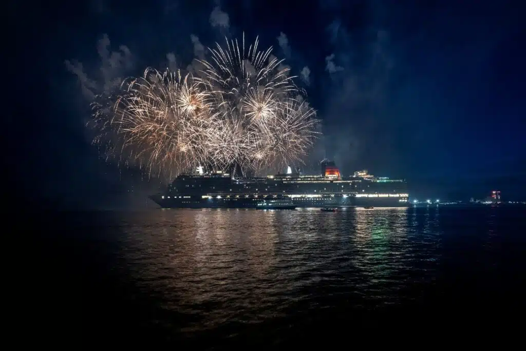 queen anne exterior fireworks maiden voyage nighttime cunard