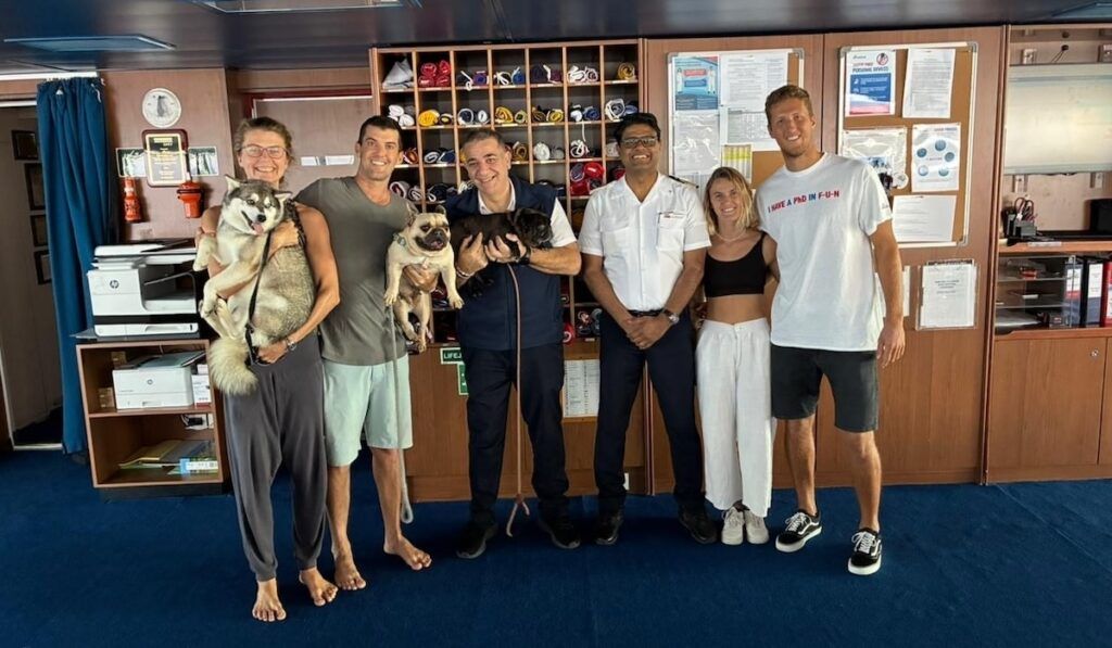 carnival cruise splendor rescues four people and three dogs